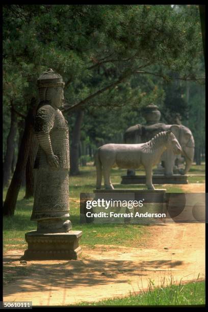 Carved stone statues on Spirit Way, sacred path to Western Qing Tombs, site of new luxury Hualong Cemetery for rich, overseas Chinese to buy imperial...