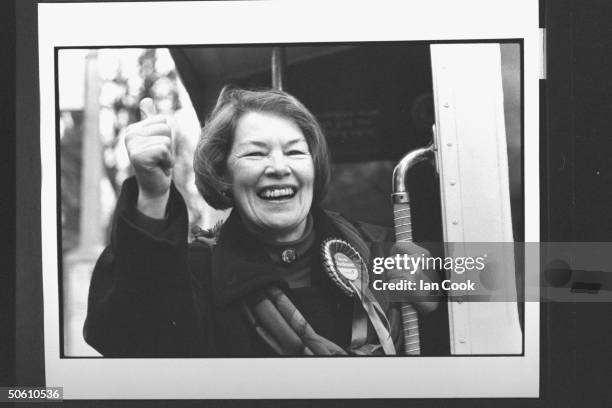 Actress/Labour Party cand. For Parliament Glenda Jackson happily giving thumbs-up sign as she boards city bus while campaigning for a seat in the...