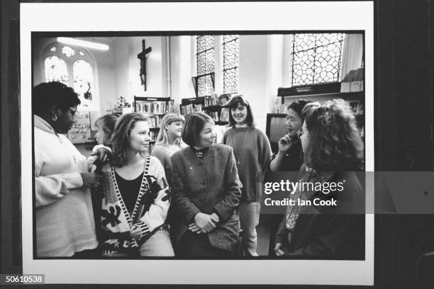 Actress/Labour Party cand. For Parliament Glenda Jackson seated amidst a group of young women at Convent School for Girls, discussing the question...