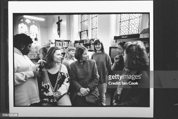 Actress/Labour Party cand. For Parliament Glenda Jackson seated amidst a group of young women at Convent School for Girls, discussing the question...