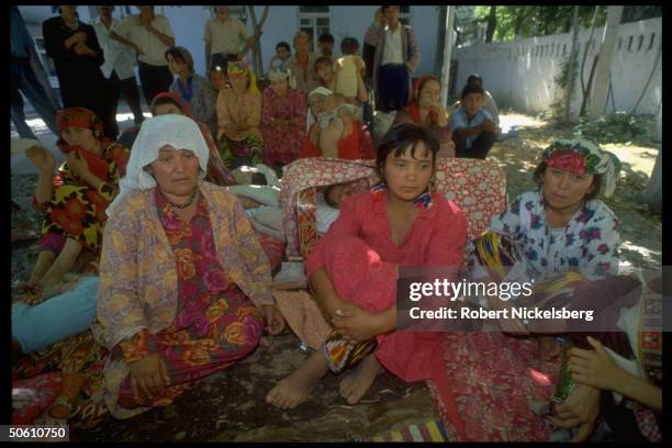 Uzbek refugee women, forced out fr. Co-op farm by men in mil. Garb, re civil strife between supporters of Islamic fundamentalism & communism.