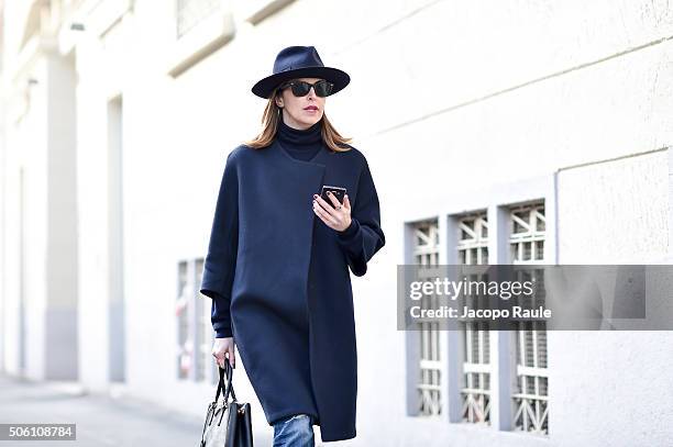 Alice Carli, Head of Global Marketing and Communication of Peuterey poses wearing Borsalino hat, Peuterey shoes, Prada bag, Current Eliott jeans and...