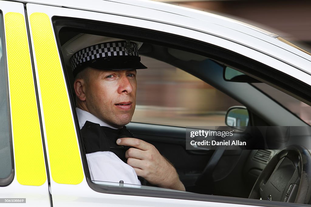 Policeman in car