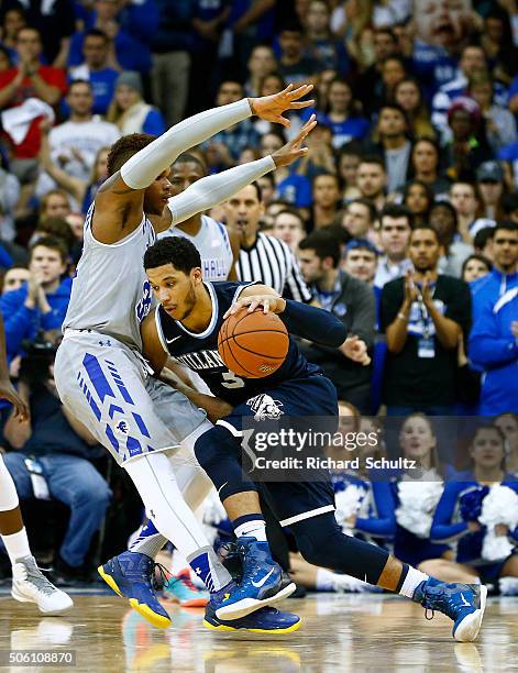 Josh Hart of the Villanova Wildcats is defended by Derrick Gordon of the Seton Hall Pirates during the second half of an NCAA college basketball game...