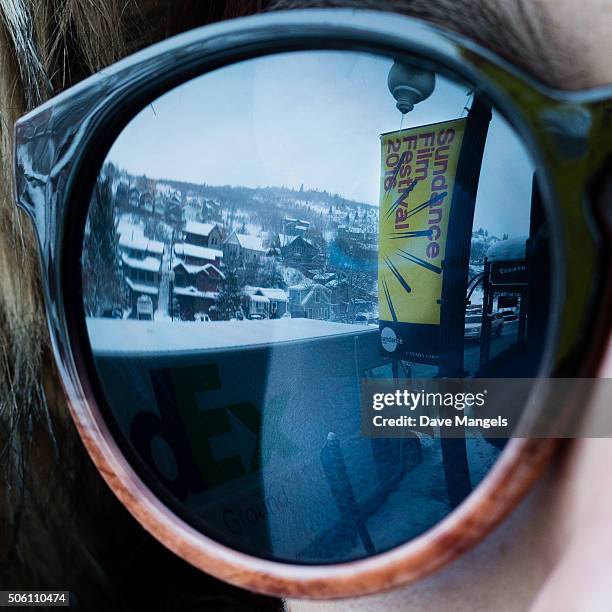 Sundance signage is seen in the reflection of a woman's sunglasses during the 2016 Sundance Film Festival on January 20, 2016 in Park City, Utah.