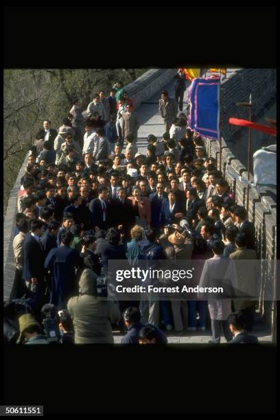 Japanese Emperor Akihito & Empress Michiko & entourage facing press mob, touring Great Wall during their controversial visit.