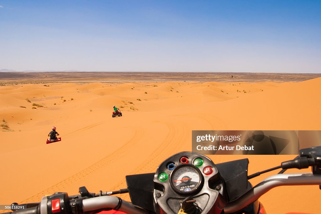 Riding a quad on first person in the dunes desert.
