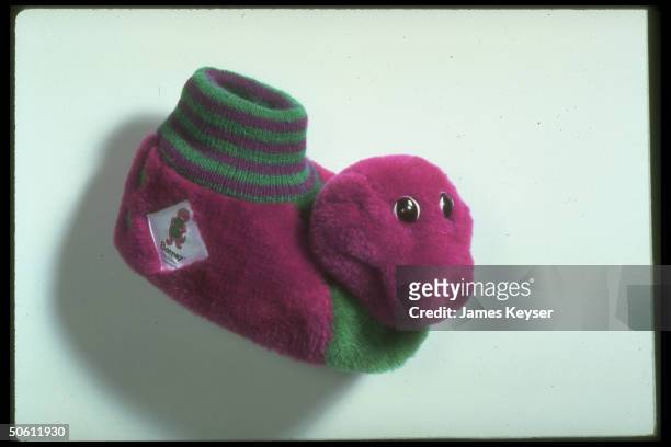 Barney the Dinosaur slipper for tiny foot, re star character of popular public TV children's show Barney & Friends.
