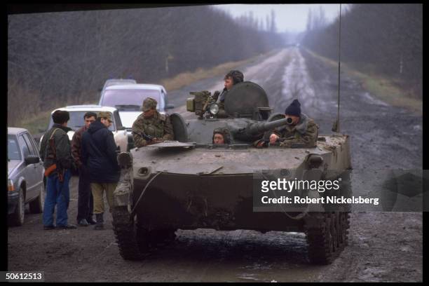 Russian APC by Chechen militia, re old foes at odds over Chechen entry into Ossetian-Ingush ethnic war in Chechnya's autonomous neighbors N. Ossetia...