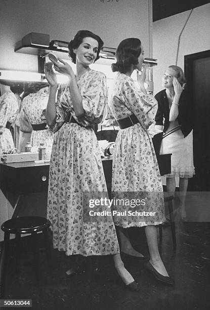 Models wearing identical Claire McCardell floral print dresses w. New longer length skirt, inspired by designer Christian Dior, and w. Shorter skirt,...