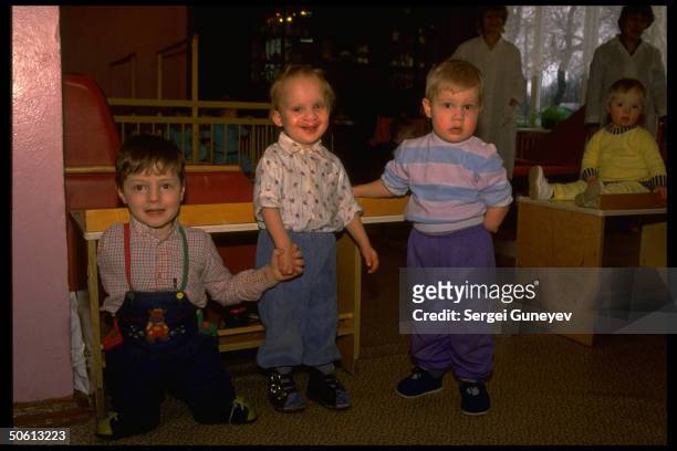Boys w. Limb & facial birth defect deformities linked to radiation contamination fr. 1986 nuclear plant accident, at children's home for Chernobyl...