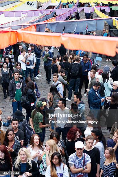 people in camden market, london - camden lock market stock pictures, royalty-free photos & images
