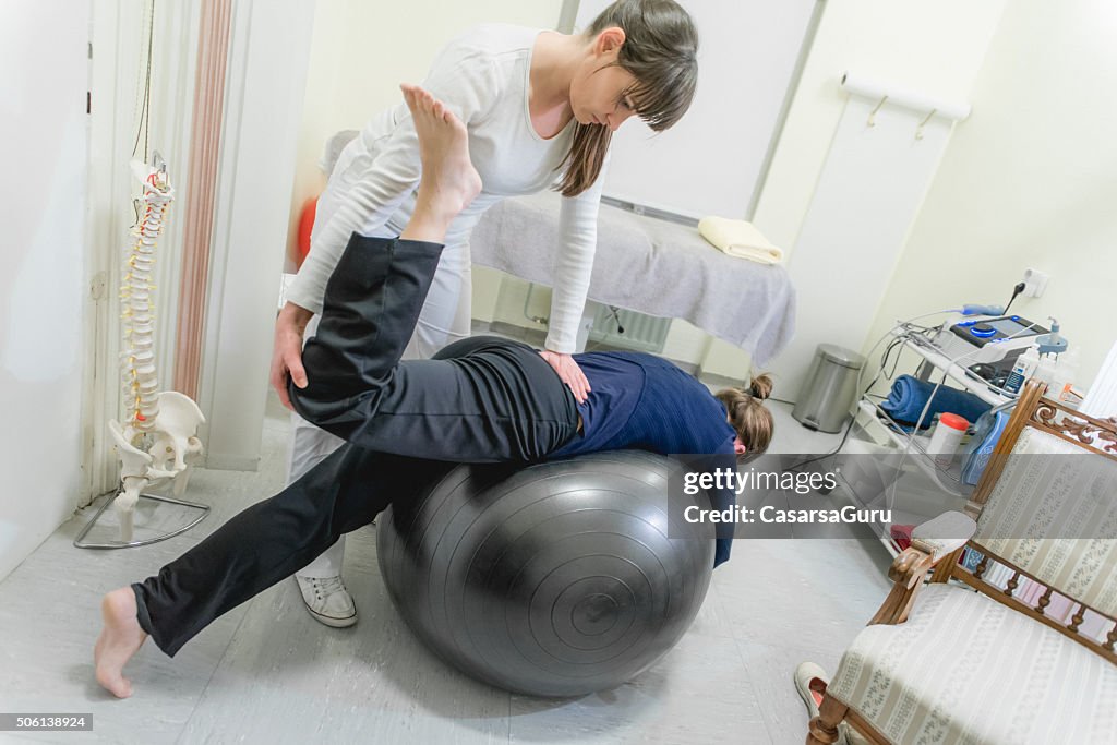 Patient Doing Pilates with Physical Therapists, Rehabilitation After Back Problem