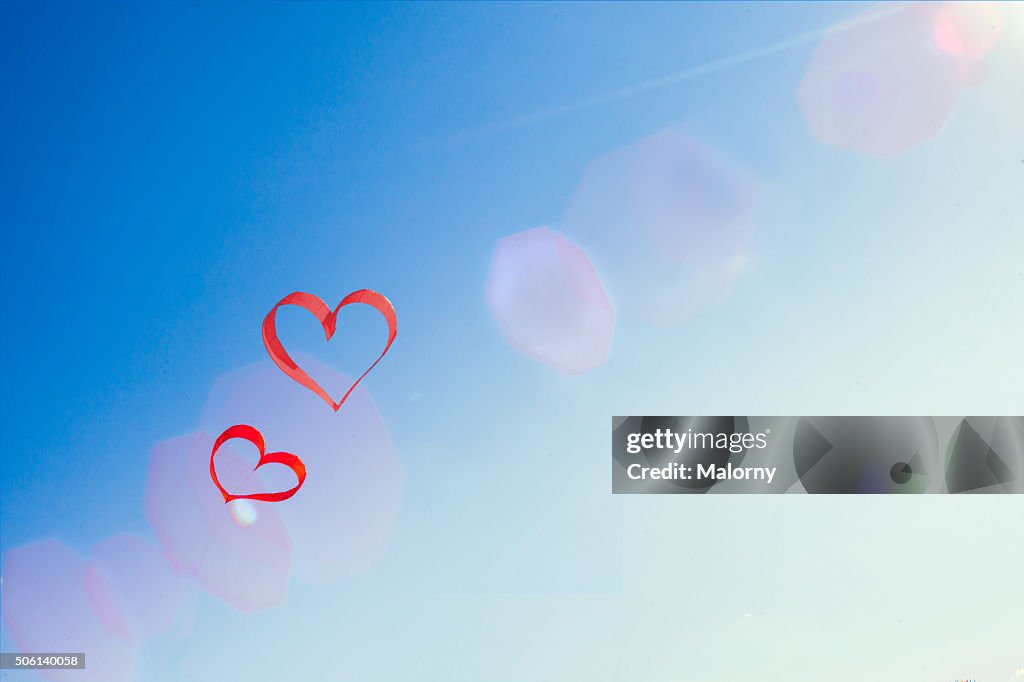 Red hearts and blue sky. Love is in the air.