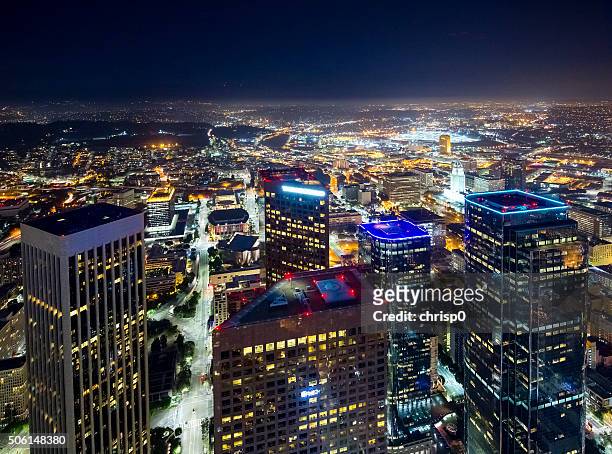 downtown los angeles skyline at night - downtown los angeles aerial stock pictures, royalty-free photos & images