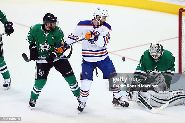 Antti Niemi of the Dallas Stars makes a save in front of Teddy Purcell of the Edmonton Oilers in the third period at American Airlines Center on...