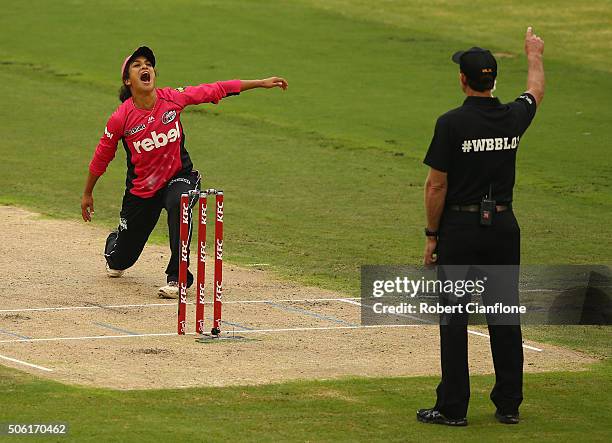 Lisa Sthalekar of the Sixers takes the wicket of Amy Sattherthwaite of the Hurricanes during the Women's Big Bash League Semi Final match between the...