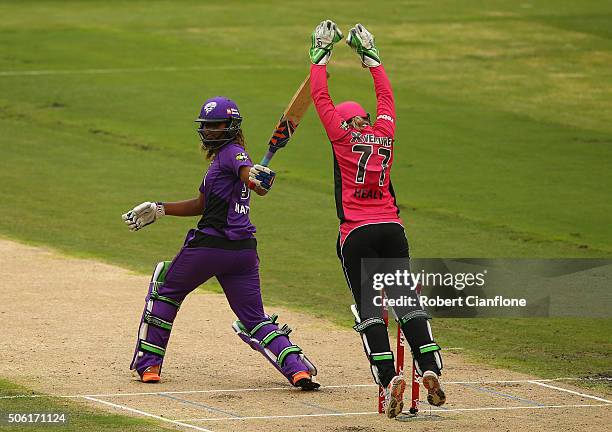 Alyssa Healy of the Sixers takes a catch to dismiss Hayley Matthews of the Hurricanes during the Women's Big Bash League Semi Final match between the...