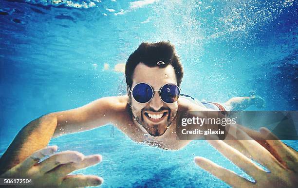 underwater fun. - man underwater stock pictures, royalty-free photos & images