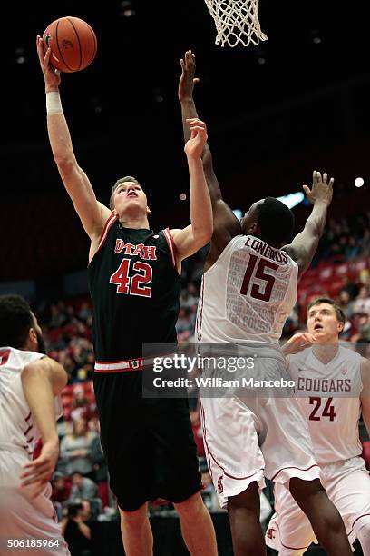 Jakob Poeltl of the Utah Runnin' Utes goes to the basket against Junior Longrus of the Washington State Cougars in the second half of the game at...