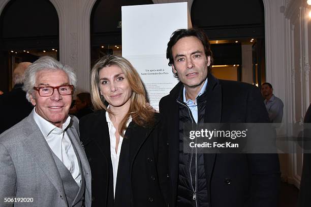 Jean-Daniel Lorieux, a guest and Anthony Delon attend the Mireille Darc Photo Exhibition Preview at Artcurial on January 21, 2016 in Paris, France.