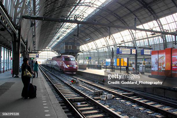 netherlands: central station in amsterdam - centraal station stockfoto's en -beelden