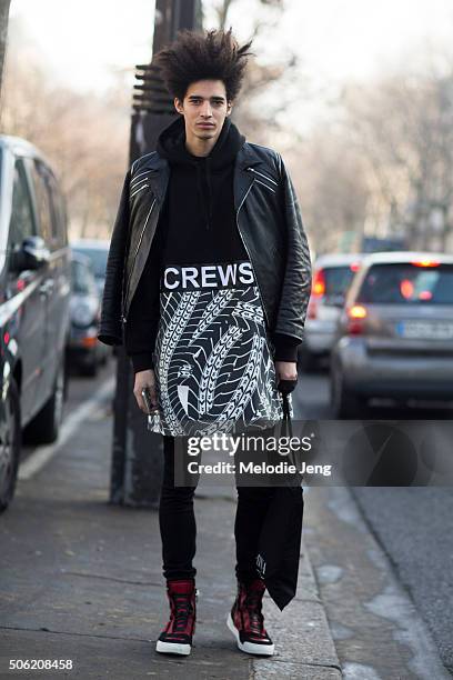 Portuguese model Luis Borges wears a black leather jacket, Andrea Crew graphic top, and red and blue basketball sneakers on January 21, 2016 in...