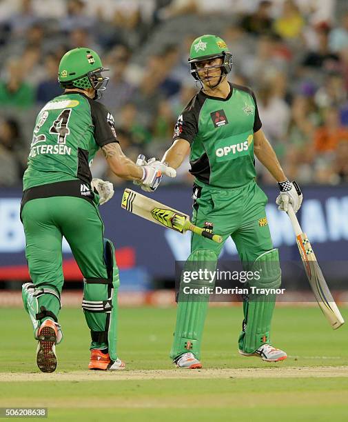 Kevin Pietersen and Marcus Stoinis of the Melbourne Stars shake hands after reaching a 50 run partnership during the Big Bash League Semi Final match...