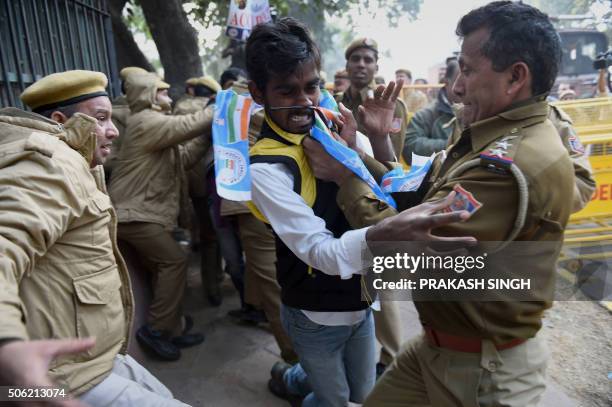 Indian police detain an activist from the National Students Union of India during a protest in New Delhi on January 22, 2016. Rohit Vemula, a...