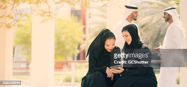 young arab people - ceremonieel gewaad stockfoto's en -beelden