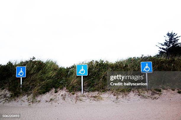 handicap parking signs at the beach. - handicapped placard stock pictures, royalty-free photos & images