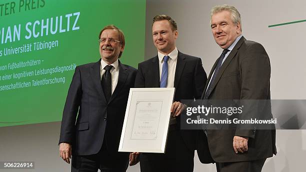 1st Prize winner of the DFB Science Award Florian Schultz poses with Rainer Koch, Senior Vice President and Peter Frymuth, Vice President Operations...