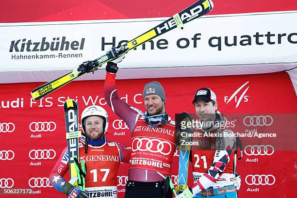 Andrew Weibrecht of the USA takes 2nd place, Aksel Lund Svindal of Norway takes 1st place and Hannes Reichelt of Austria takes 3rd place during the...