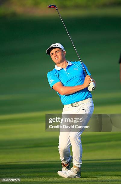 Rickie Fowler of the United States anxiously folllows his second shot at the par 5, 10th hole during the second round of the 2016 Abu Dhabi HSBC Golf...