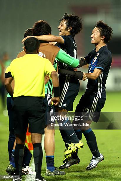 Shoya Nakajima of Japan is congraulated by his team mates after scoring a goal in extra time during the AFC U-23 Championship quarter final match...