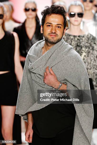 Designer Emre Erdemoglu attends his show during the Mercedes-Benz Fashion Week Berlin Autumn/Winter 2016 at Brandenburg Gate on January 22, 2016 in...