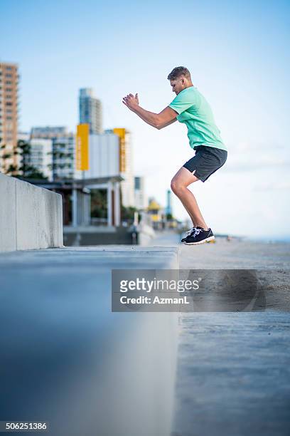jumping high in the sky - men's field event stock pictures, royalty-free photos & images