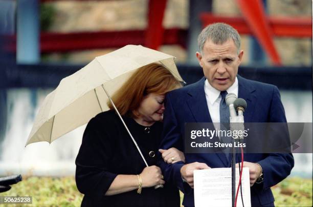 Grieving Dennis & Judy Shepard at funeral for their son Matthew, openly gay Univ. Of Wyoming student who died of wounds suffered in savage assault...