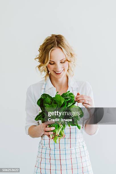 young woman with fresh spinach - spenat bildbanksfoton och bilder