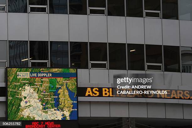 Doppler radar screen is seen on an office building as a snow storm approaches the area on January 22, 2016 in Washington,DC. Thousands of flights...