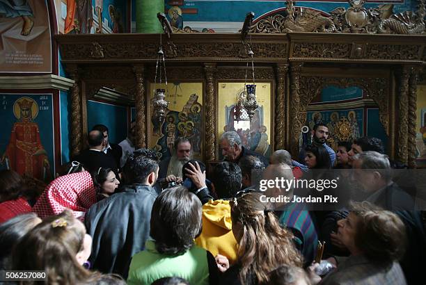 Worshipers pray in the Orthodox church of St. John the Baptist as Metropolitan Venediktos of Philadelphia leads a few thousand Orthodox Christian...