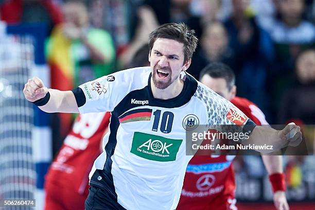 Fabian Wiede of Germany celebrates after scoring during the Men's EHF Handball European Championship 2016 match between Germany and Hungary at...