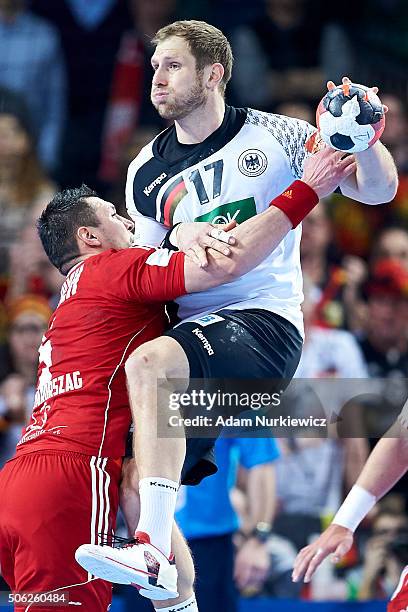 Steffen Weinhold of Germany fights for the ball during the Men's EHF Handball European Championship 2016 match between Germany and Hungary at...