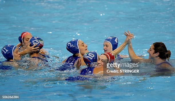 Italy's national water polo team players celebrate after winning the women's water polo bronze medal match against Spain at the European Water polo...