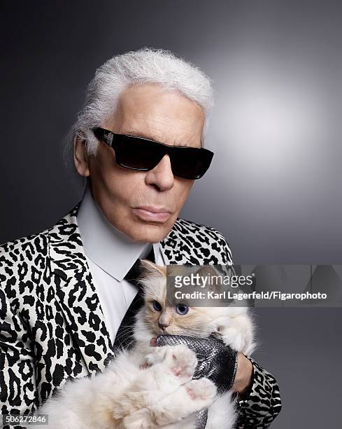 Fashion designer Karl Lagerfeld is photographed with his cat Choupette for Madame Figaro on November 18, 2015 in Paris, France. COVER IMAGE. CREDIT...