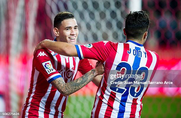 Arnaldo Sanabria of Real Sporting de Gijon celebrates with his teammates Jony Rodriguez of Real Sporting de Gijon after scoring his team's fourth...