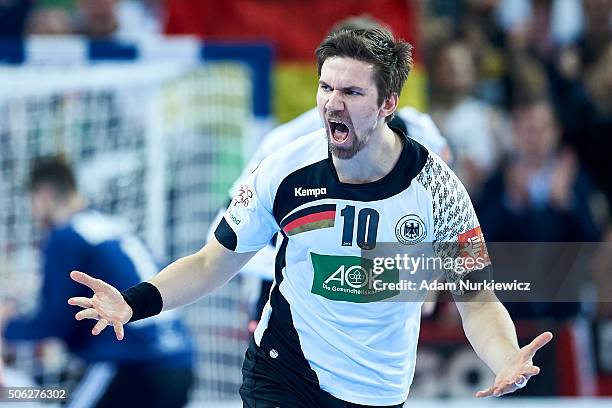 Fabian Wiede of Germany celebrates after scoring during the Men's EHF Handball European Championship 2016 match between Germany and Hungary at...