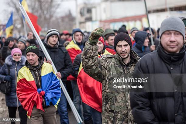 Opponent Moldavians shout slogans and carry Moldavian flags during an anti-government protest, demanding resignation of the government and early...