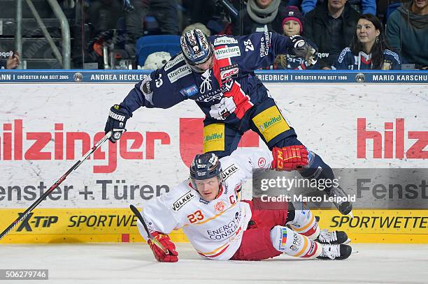 Daniel Kreutzer of the Duesseldorfer EG and Jens Baxmann of the Eisbaeren Berlin during the DEL game between the Eisbaeren Berlin and Duesseldorfer...