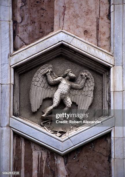 One of several hexagonal marble tiles with sculpted reliefs mounted in the exterior marble walls of the Campanile di Giotto, or the Florence...